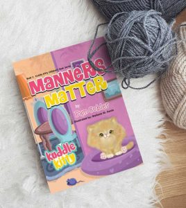 Manners Matter book next to balls of yarn